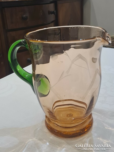 Old, engraved, broken glass jug, multicolored