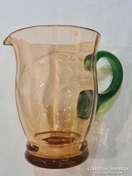 Old, engraved, broken glass jug, multicolored