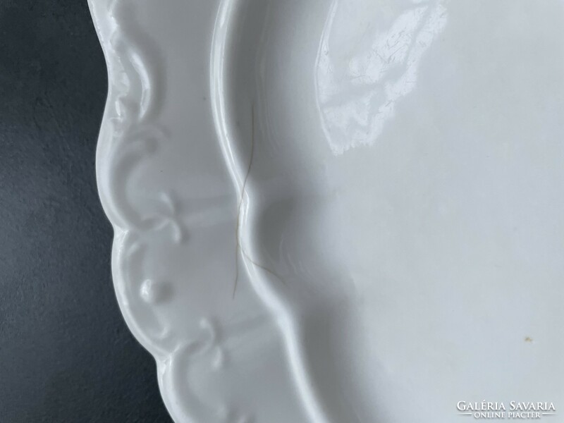 Old white porcelain serving bowl with handle, center of the table