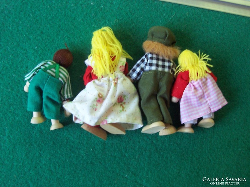 Wooden toy figures together with the family