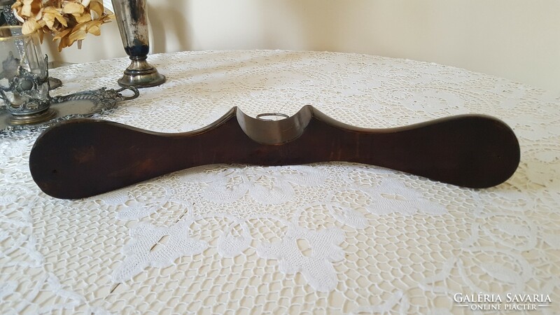 Old, curved, thick wooden hanger
