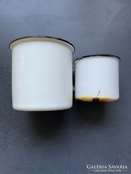 Pair of old white enamel mugs
