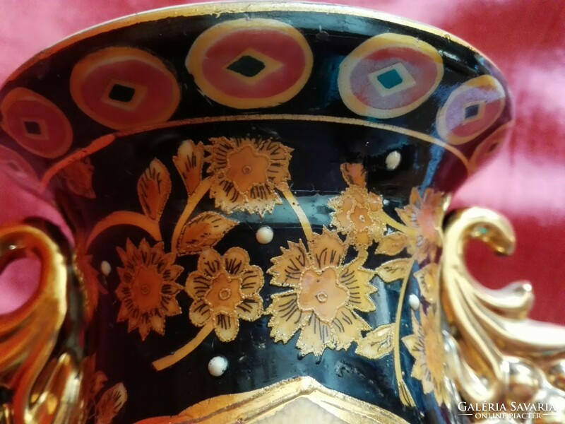 An old, hand-painted, richly decorated porcelain vase....Oriental.
