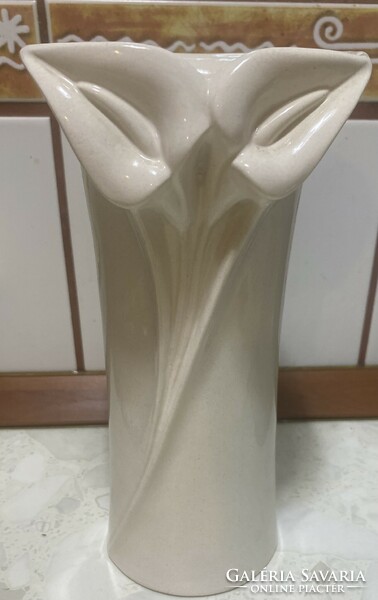 Unpainted glazed ceramic faience vase with marked flower decoration