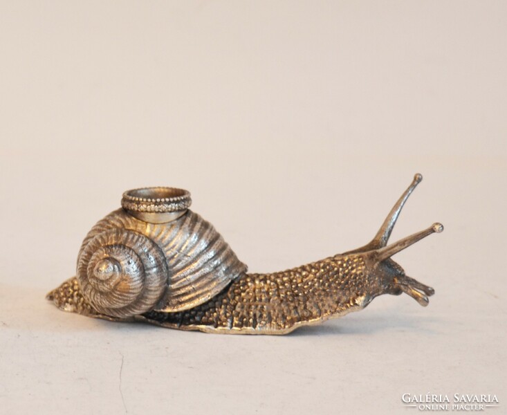 Silver snail-shaped candle holder