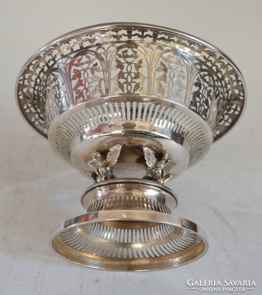 Silver basket-shaped centerpiece decorated with plastic eagles