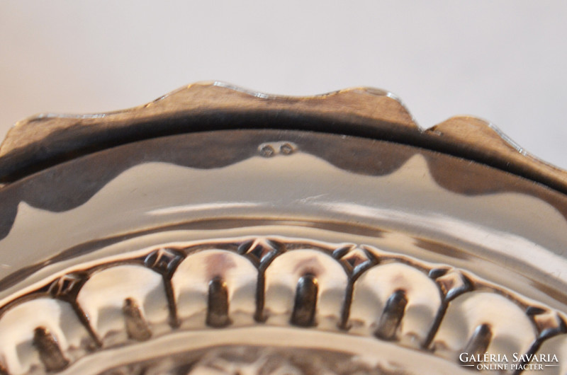 Silver sugar box with a plastic child figure on top