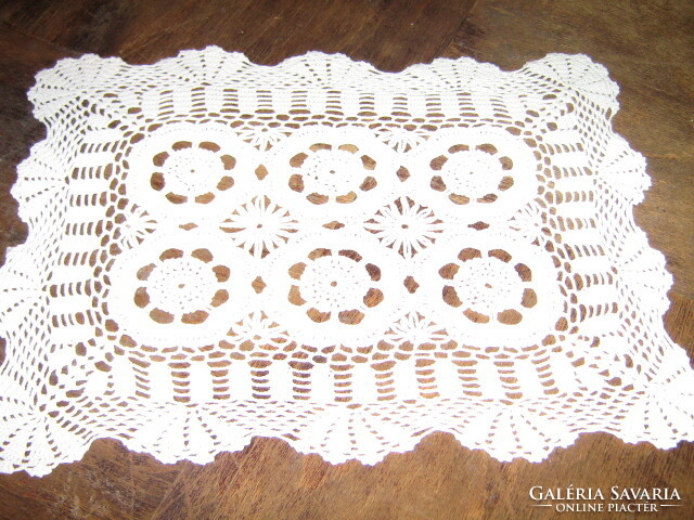 Beautiful hand-crocheted snow-white lace tablecloth