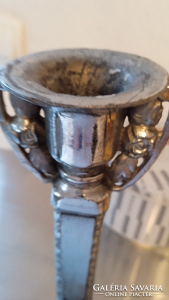 Silver colored. Metal candle holder