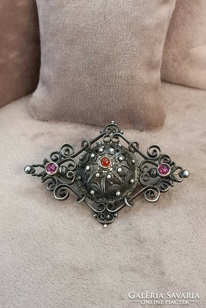 Antique silver brooch with garnet stones