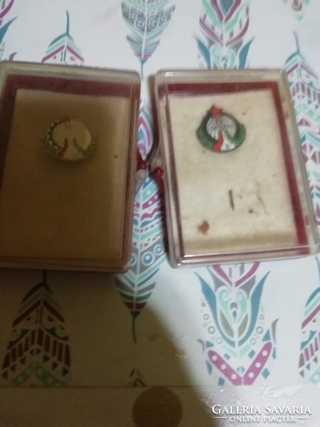 In a box of old badges
