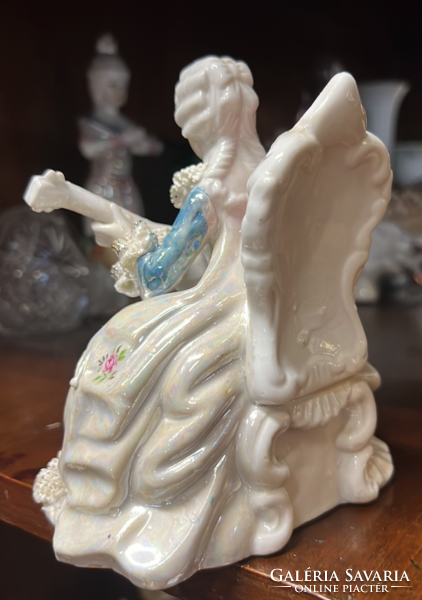 Porcelain baroque aristocrat lady with guitar in lace dress