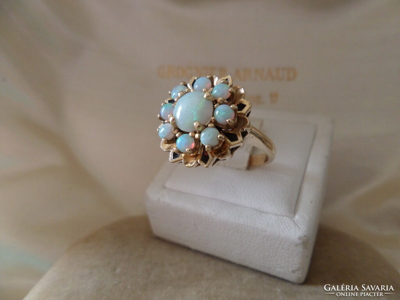 Gold cocktail ring with genuine opals and black enamel