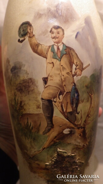 Old glass jug with glasses with a painting of a hunting trophy