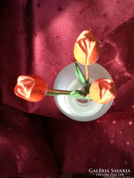 Wooden tulips in a glass vase