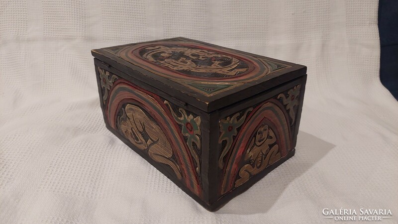 Carved and painted wooden box with salamander figures, human representation