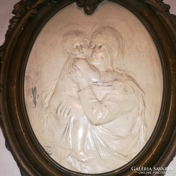 A religious wall picture of Mary with her baby, a beautiful piece