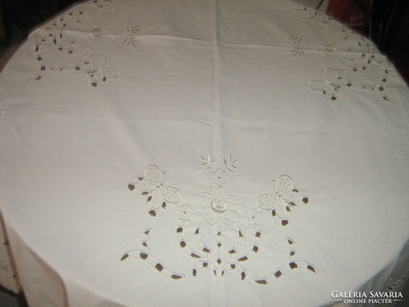 Beautiful bone-colored flower and butterfly patterned tablecloth