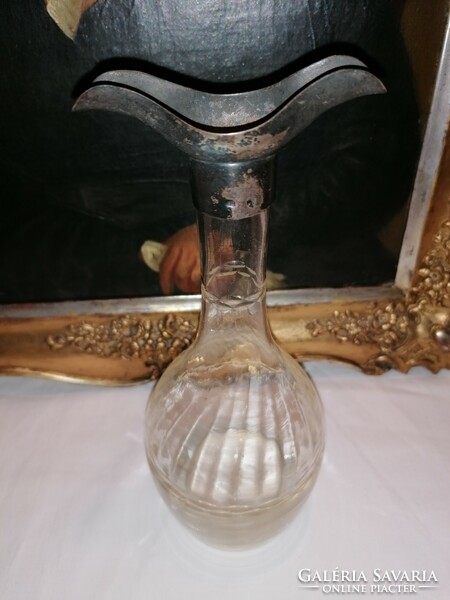 Glass drinking bottle with silver head