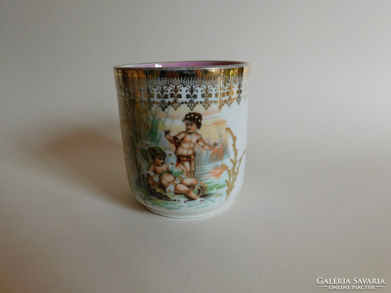 Antique mug with putty decoration