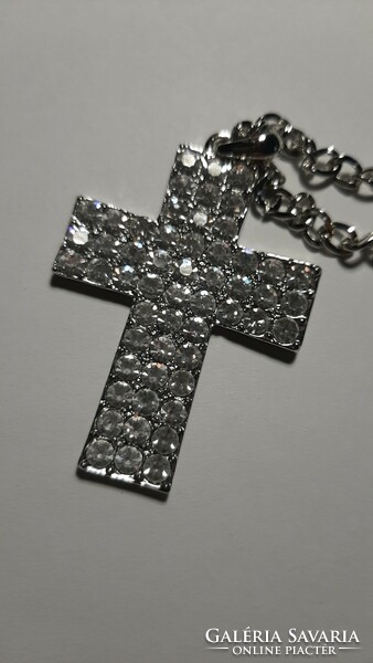 A large cross pendant necklace studded with beautiful crystals