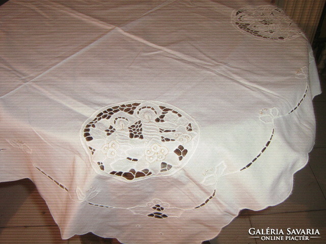 Beautiful tablecloth with a special snow-white riceli pattern embroidered with gold in four corners