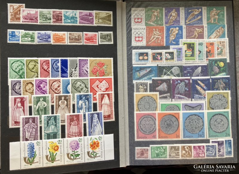 Deep green stamp album in good condition with Hungarian postage stamps