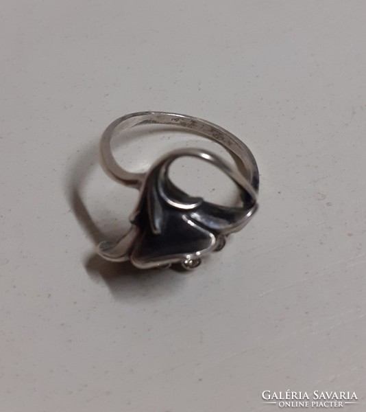 Antique silver ring with unique markings in the shape of a mountain meadow with many white polished stones