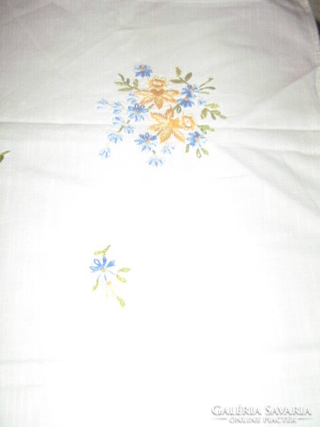 Beautiful hand-embroidered tablecloth with daffodils