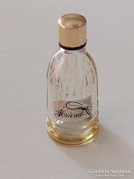 Old-fashioned perfume glass cologne bottle with vintage label