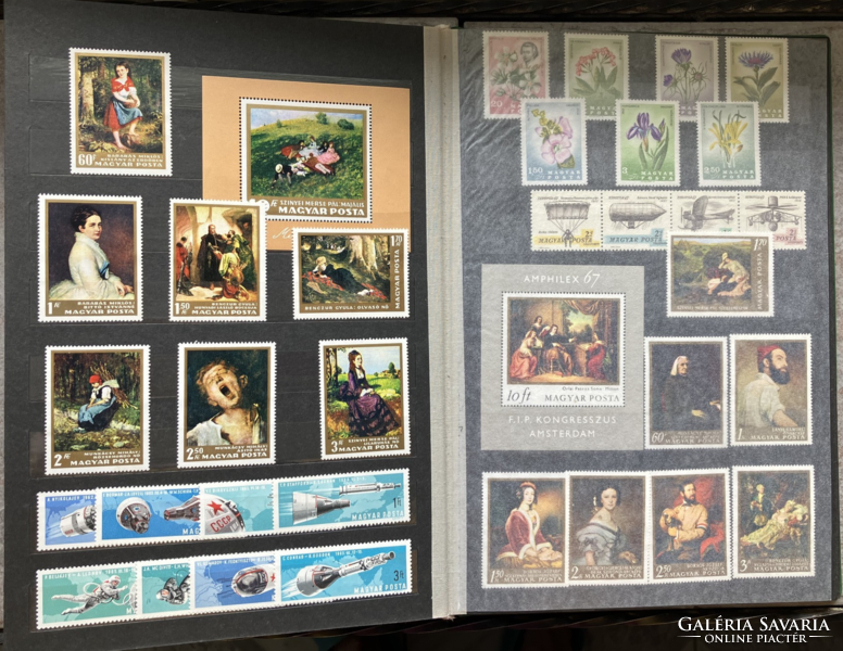 Deep green stamp album in good condition with Hungarian postage stamps