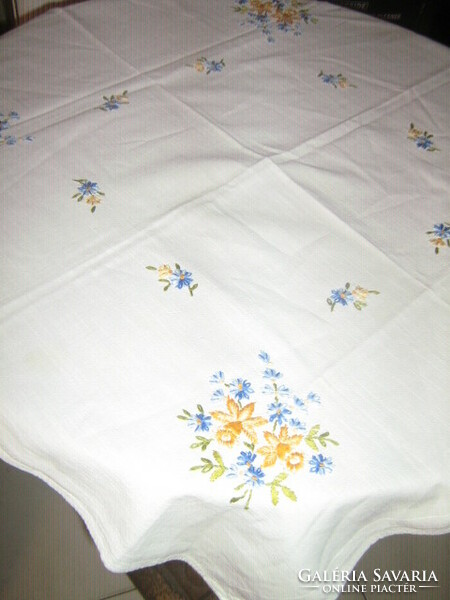 Beautiful hand-embroidered tablecloth with daffodils