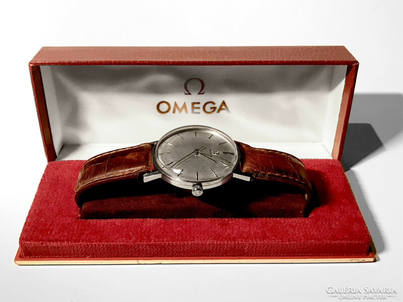 Very nice silver dial omega 35 mm diameter but looks like 37-38! Factory box! Accurate!