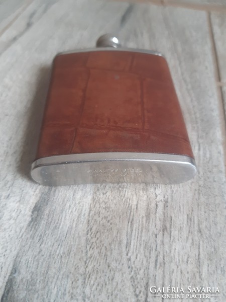 A sumptuous old leather-covered steel flask