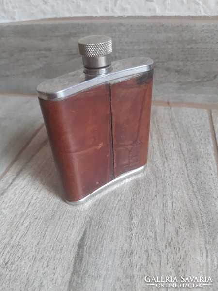 A sumptuous old leather-covered steel flask