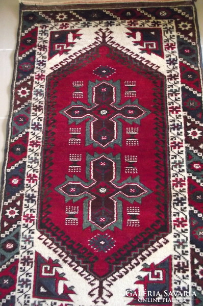 Persian rug with a kazakh pattern.