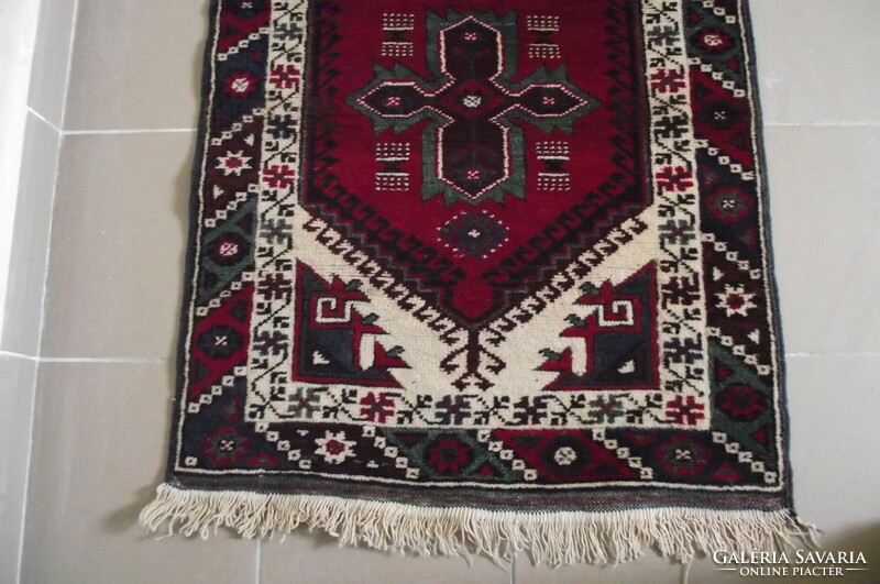 Persian rug with a kazakh pattern.