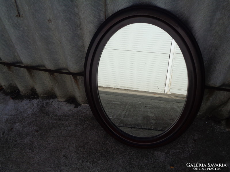 Oval mahogany mirror