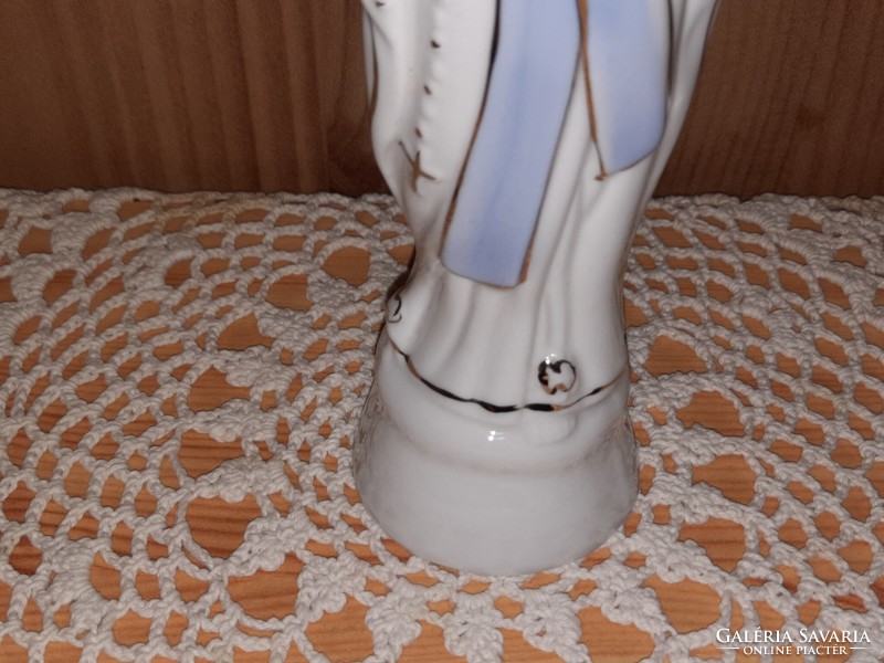 Old porcelain Virgin Mary statue