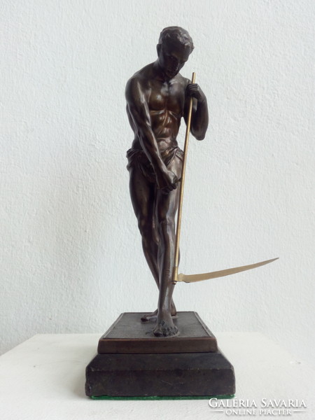 Reaper man with scythe, bronze statue