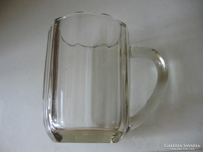 Antique faceted, polished glass jug with a brownish hue