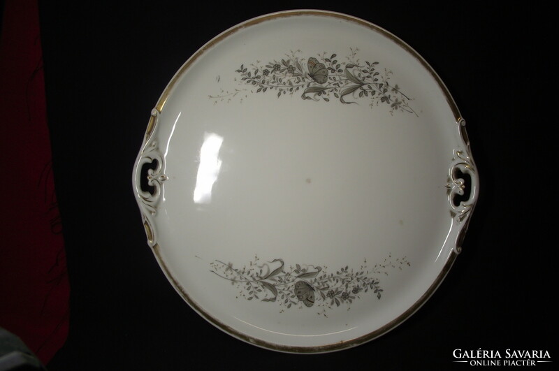 Large serving plate with handles.