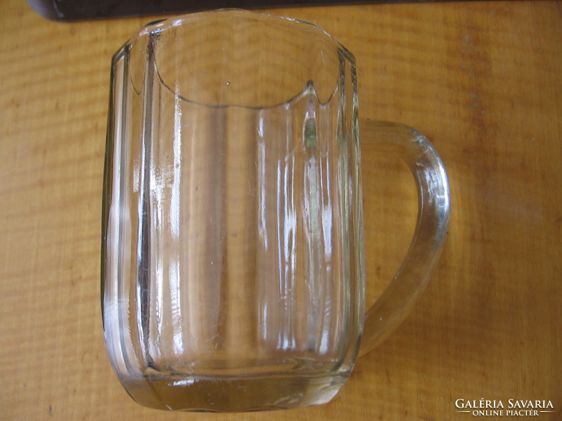 Antique faceted, polished glass jug with a brownish hue