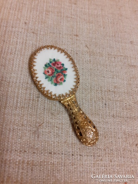Small mirror with filigree handle decorated with old tapestry