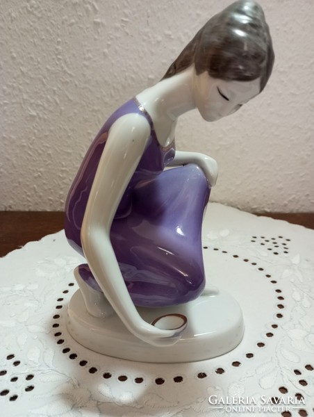 A diving girl in a purple dress from Raven House