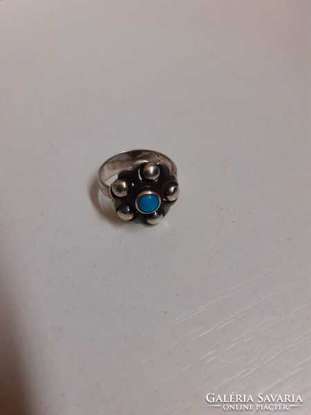 Antique silver ring made with unique goldsmith's work, studded with a turquoise stone