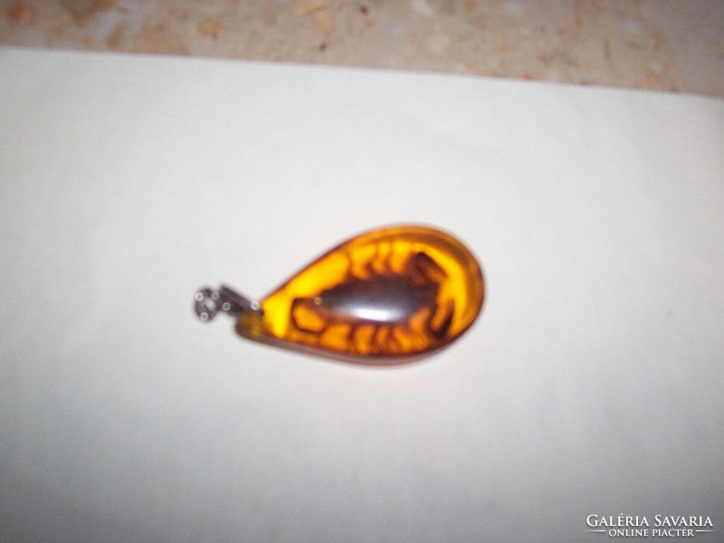 Scorpio pendant cast in amber