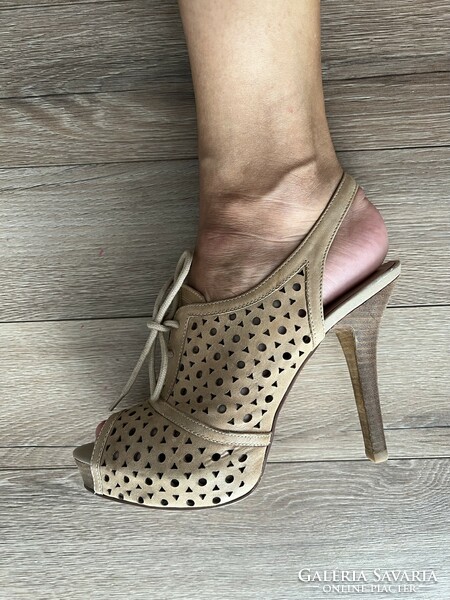 High-heeled leather sandals in beige color