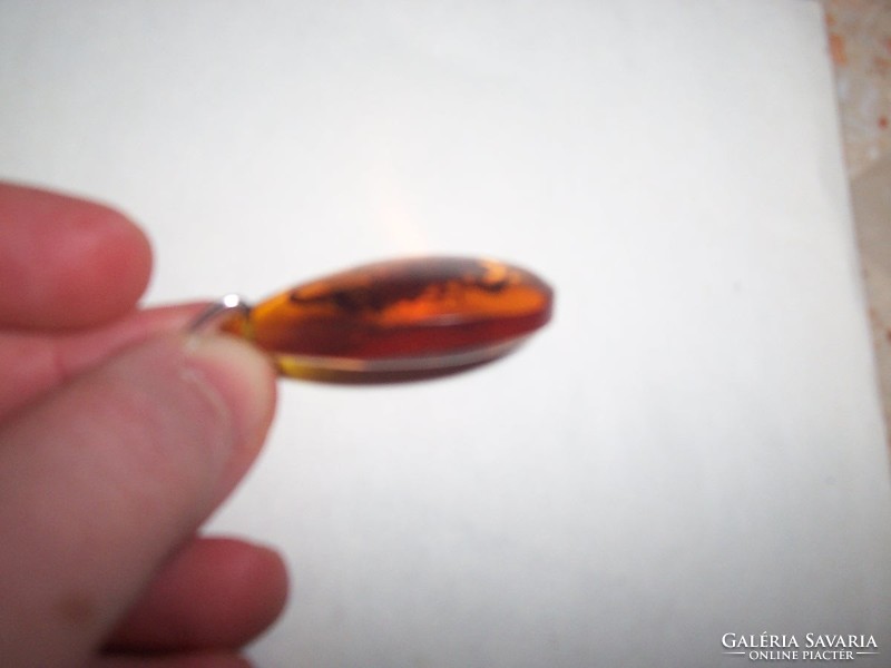 Scorpio pendant cast in amber