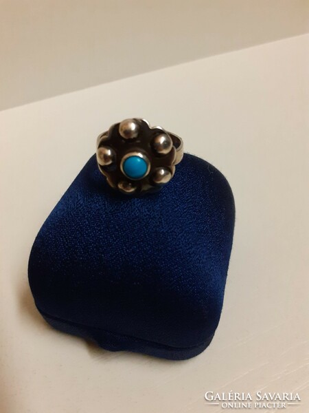 Antique silver ring made with unique goldsmith's work, studded with a turquoise stone